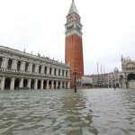 Wide view of Venice in Italy during the high tide in Winter with bell tower of Saint Mark in the main square